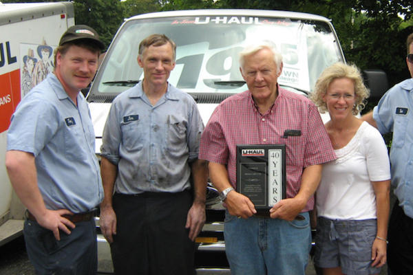 Melson family with an award from U-Haul for 40 years of outstanding service to customers of U-Haul