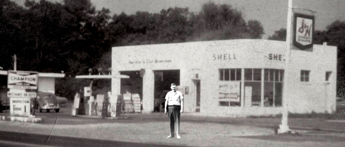 Melson's car repair garage in black and white